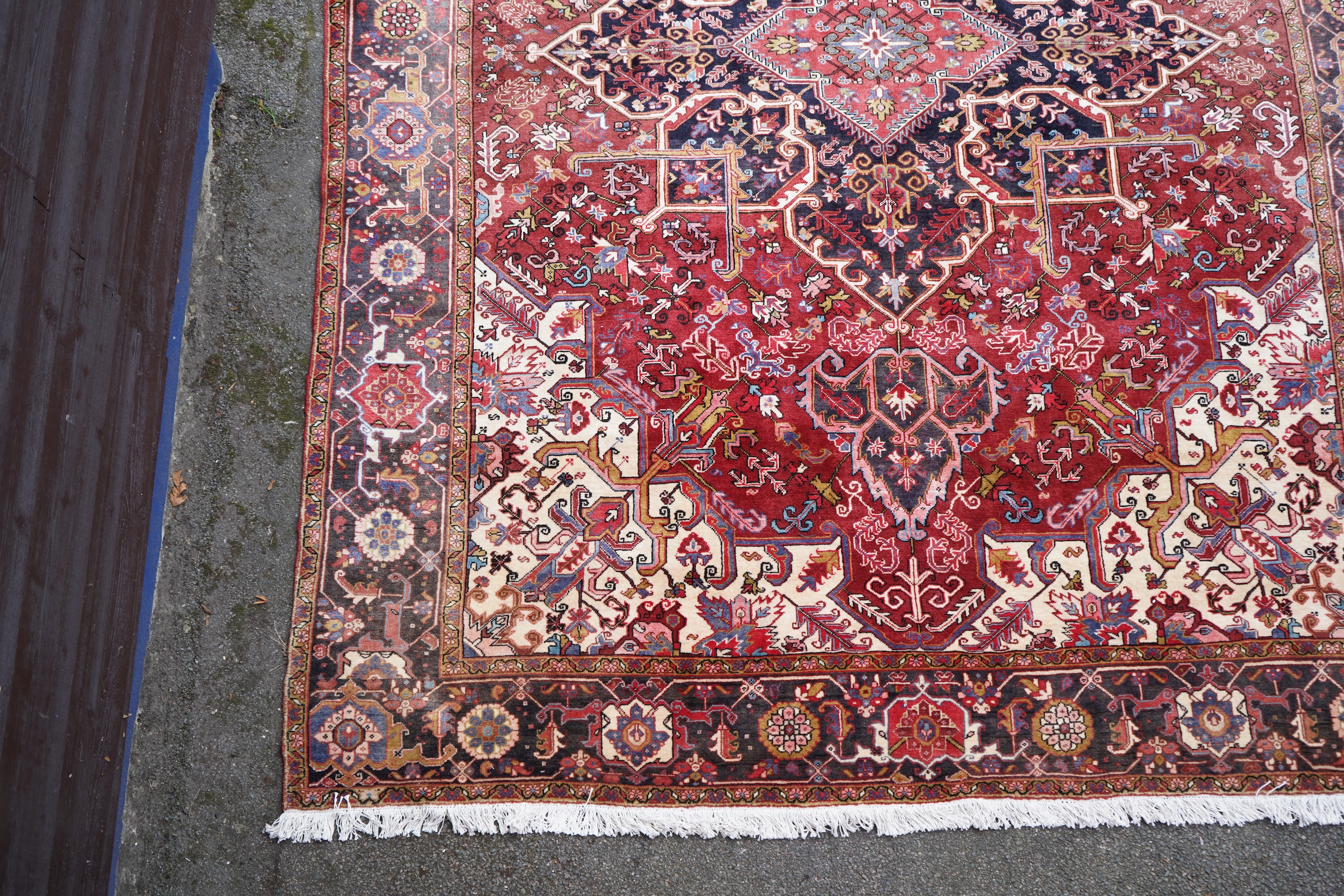 A Heriz red ground carpet